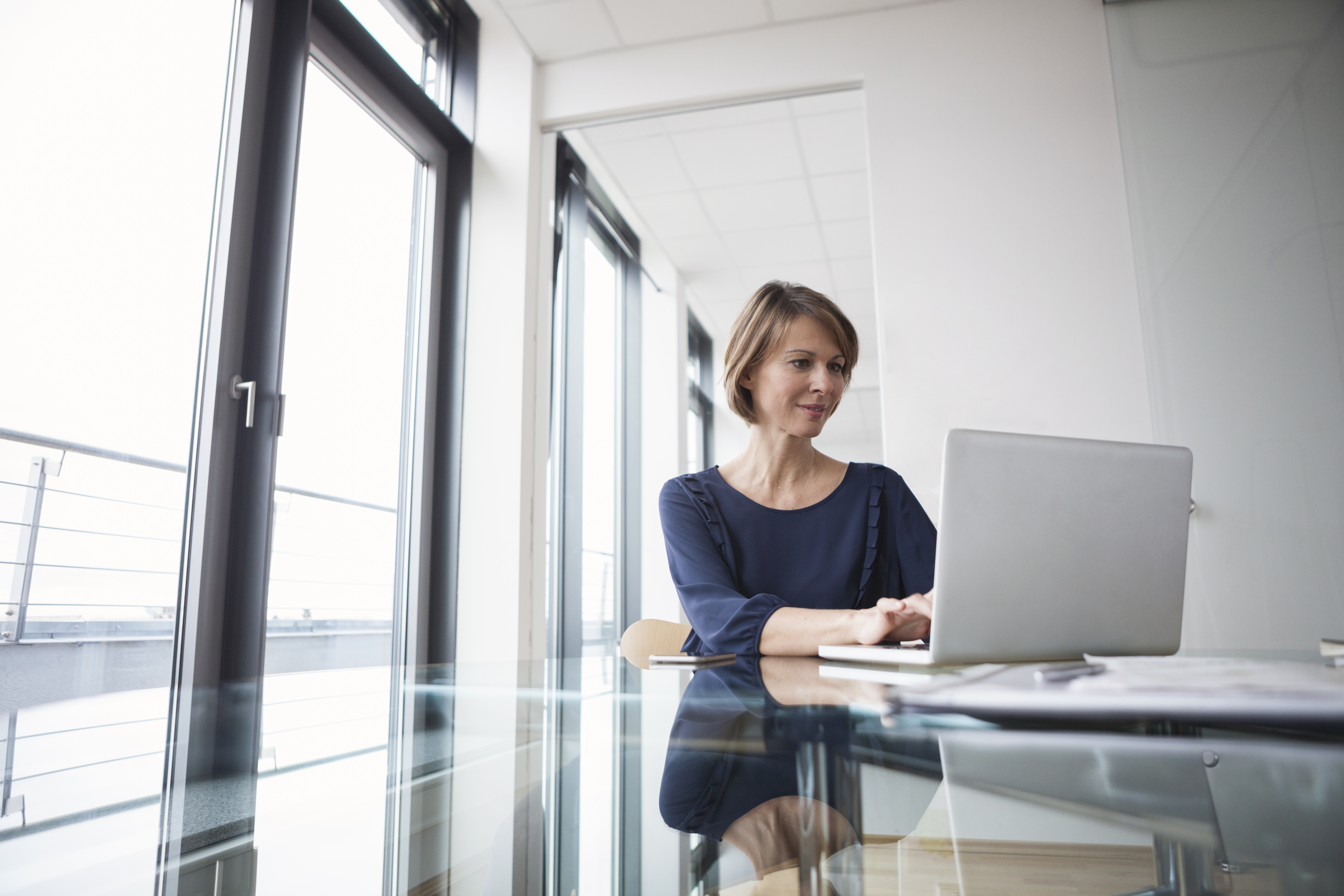 Businesswoman Working On Laptop At Office Desk 2022 03 08 01 29 29 Utc